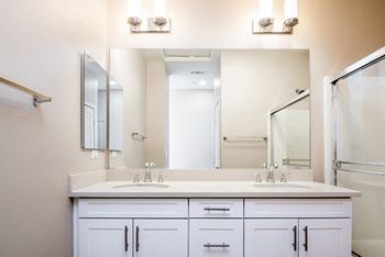Bathroom with two sinks at Ocean Air, San Diego